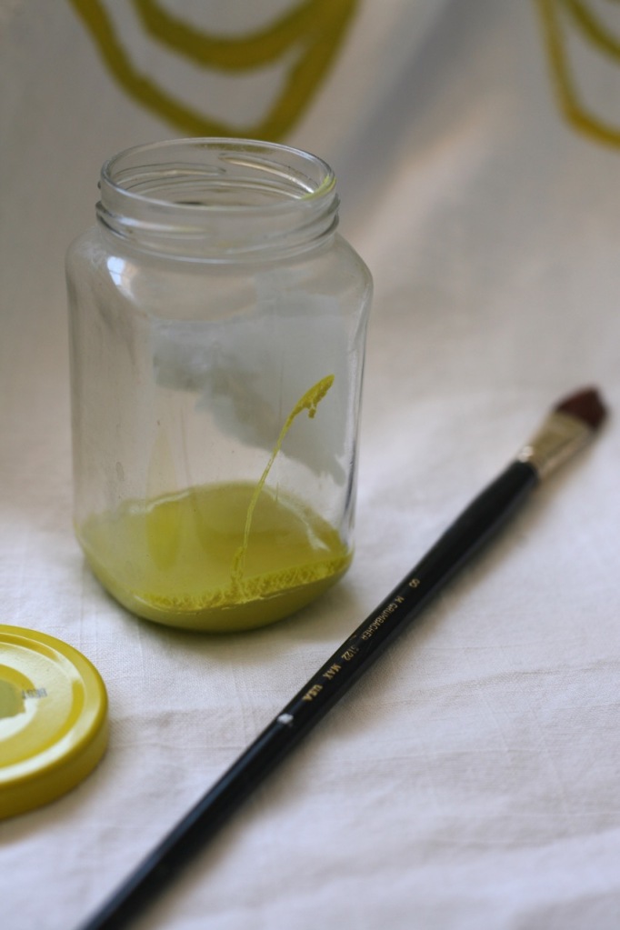 paint jar and brush yellow